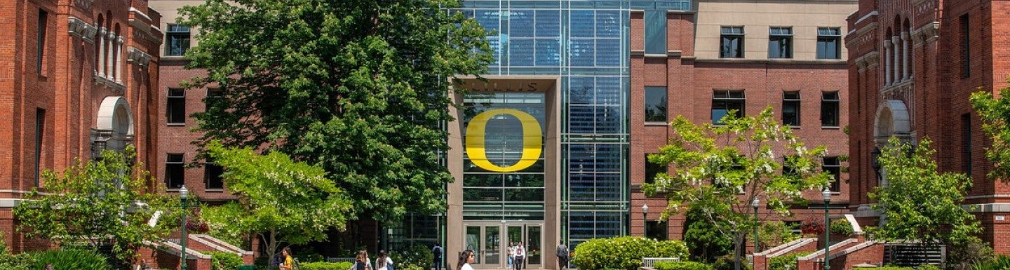 Exterior of the Lillis Business Complex with the Oregon O on display