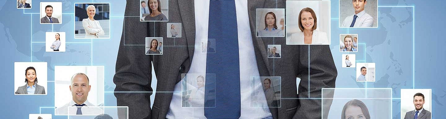 Man standing behind a board of people with intersecting lines between them